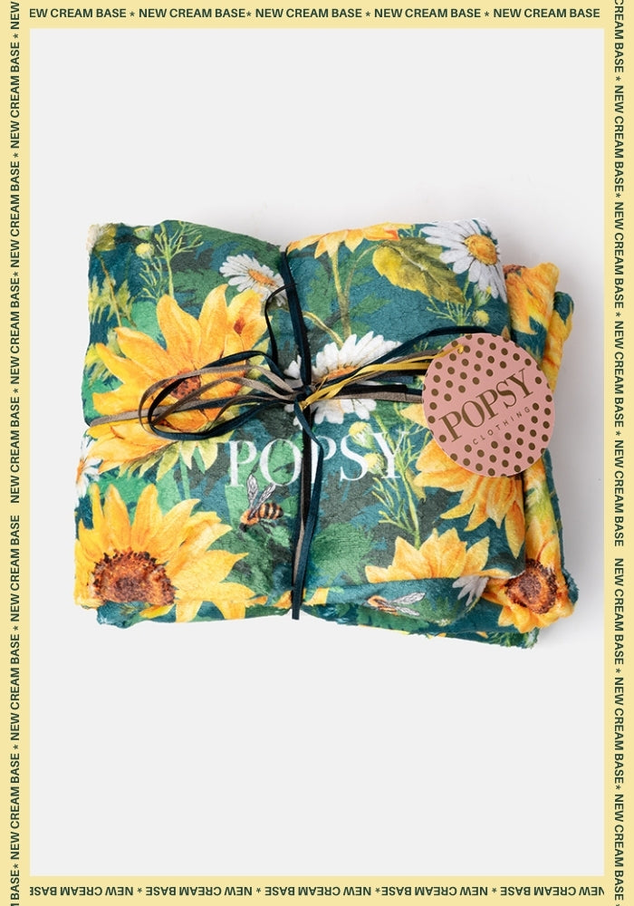Front view of Pop-under Sunflower &amp; Bee Border Print Plush Blanket