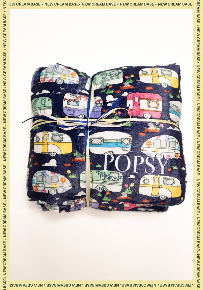 Front view of Caravan Print Pop-under Plush Blanket