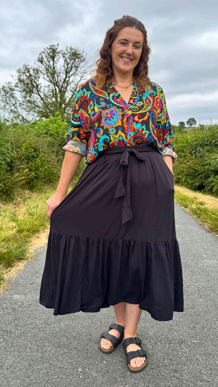 Third angle of Bina Black Tiered Hem Viscose Midi Skirt