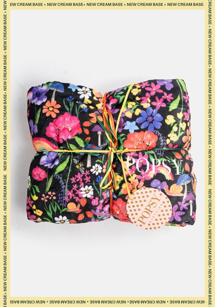 Front view of Garden Rainbow Print Plush Throw Blanket (Pop-Under)