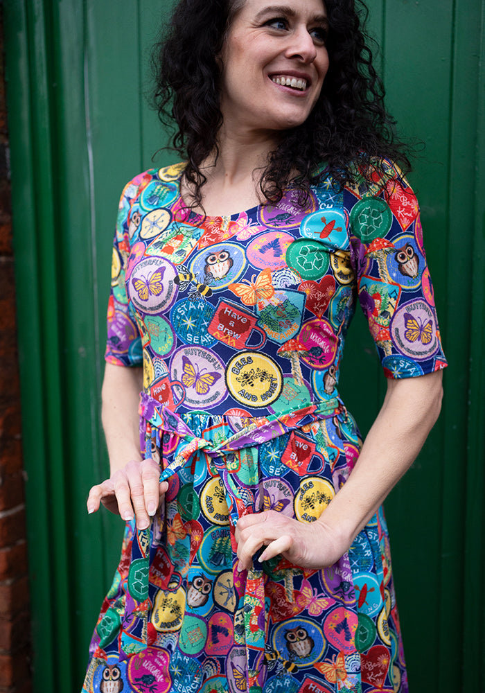 Ninth angle of Annika Badges Print Dress, our jersey is a smooth, stretchy fabric known for its comfort and ease.