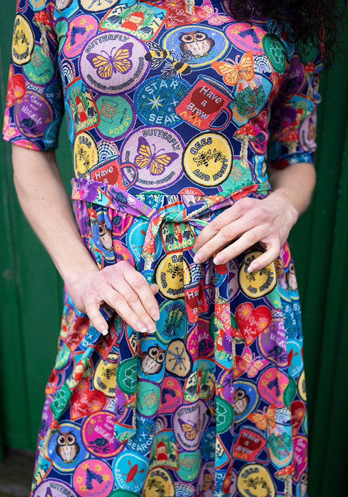 Eleventh angle of Annika Badges Print Dress, our jersey is a smooth, stretchy fabric known for its comfort and ease.