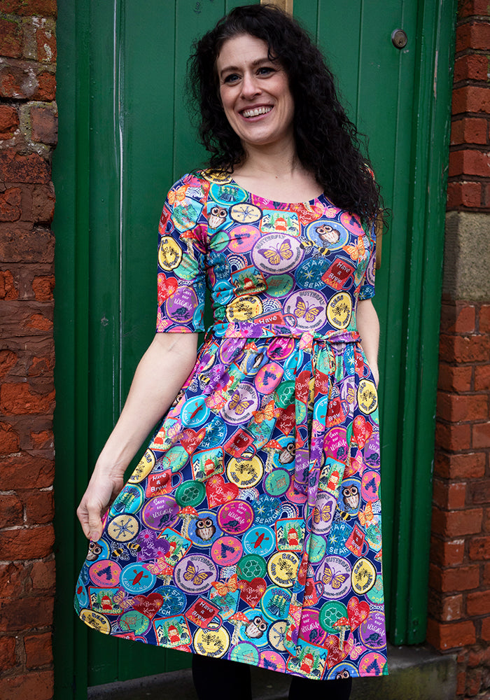 Seventh angle of Annika Badges Print Dress, our jersey is a smooth, stretchy fabric known for its comfort and ease.