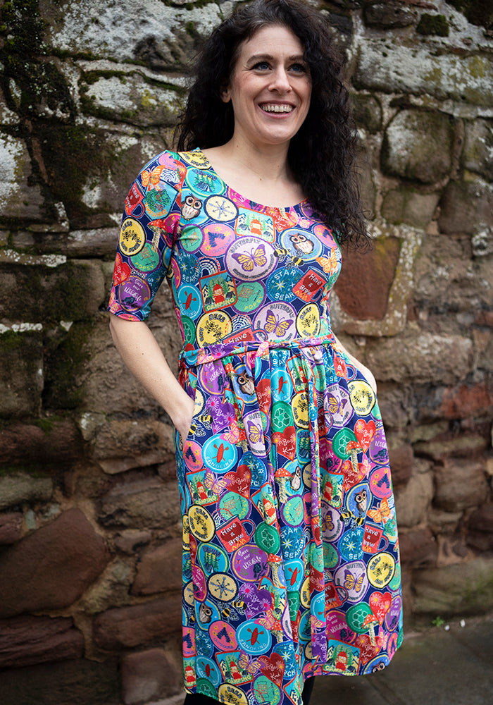 Fourth angle of Annika Badges Print Dress, our jersey is a smooth, stretchy fabric known for its comfort and ease.