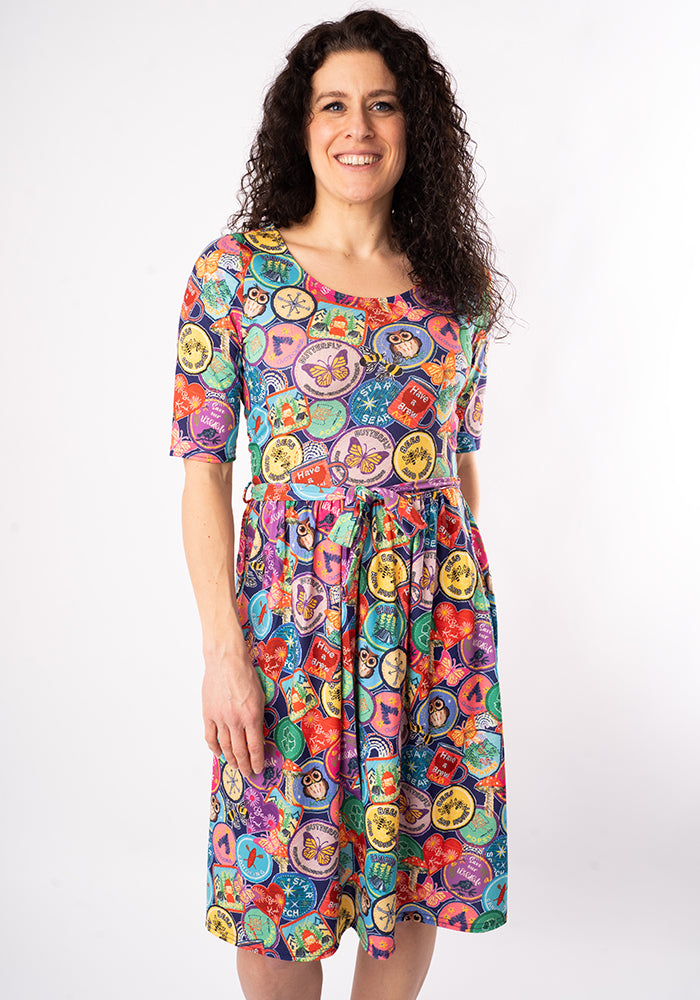 Sixth angle of Annika Badges Print Dress, our jersey is a smooth, stretchy fabric known for its comfort and ease.