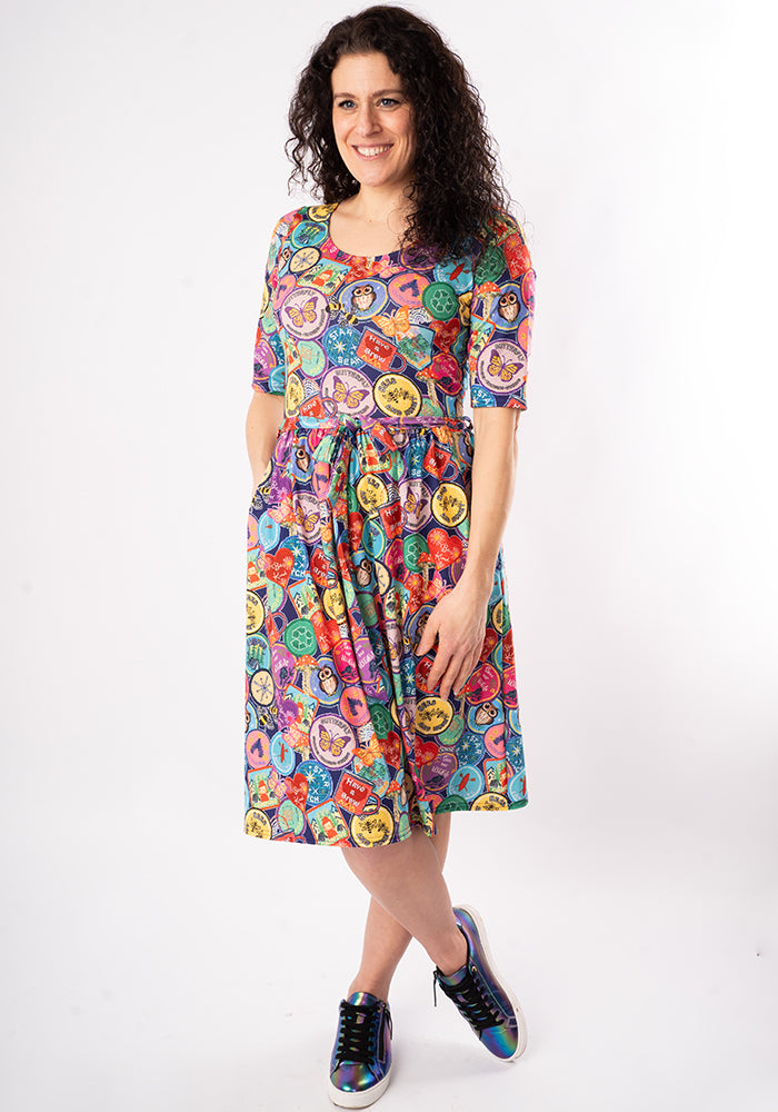 Third angle of Annika Badges Print Dress, our jersey is a smooth, stretchy fabric known for its comfort and ease.
