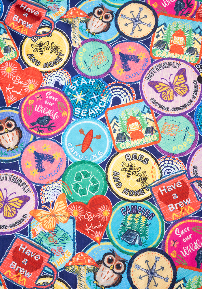 Second angle of Annika Badges Print Dress, our jersey is a smooth, stretchy fabric known for its comfort and ease.