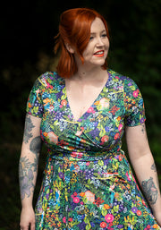 Woman wearing a colourful floral dress 