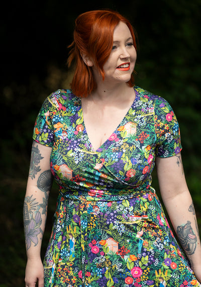 Woman wearing a colourful floral dress 