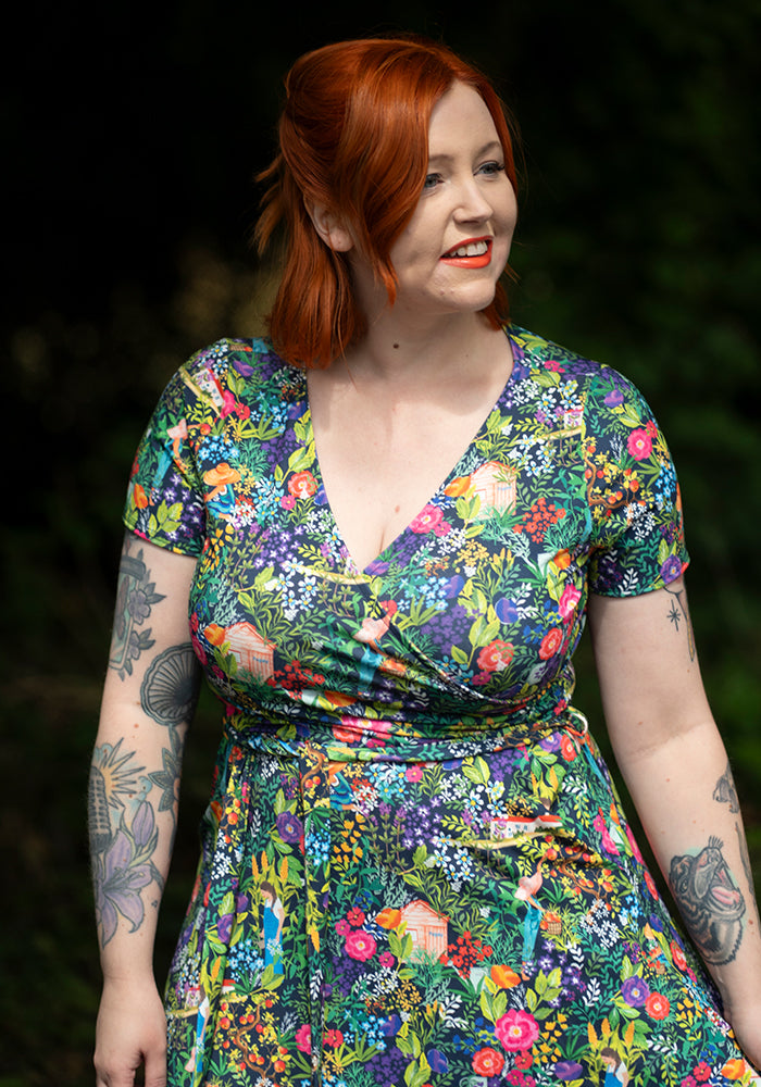 Woman wearing a colourful floral dress 