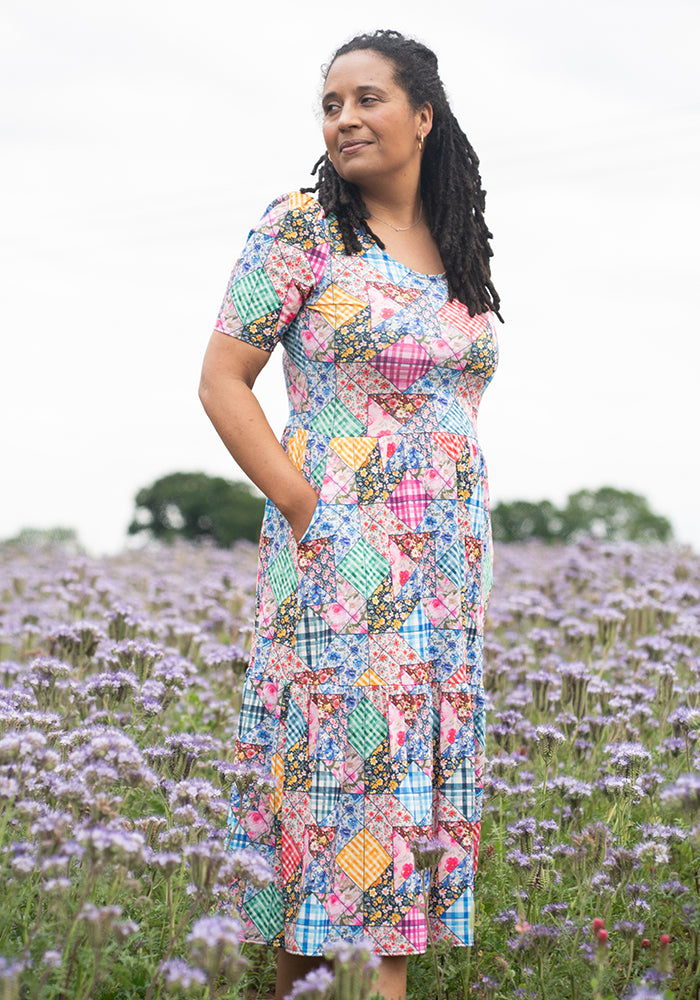 Front view of Aralon Patchwork Quilt Print Tiered Hem Midi Dress