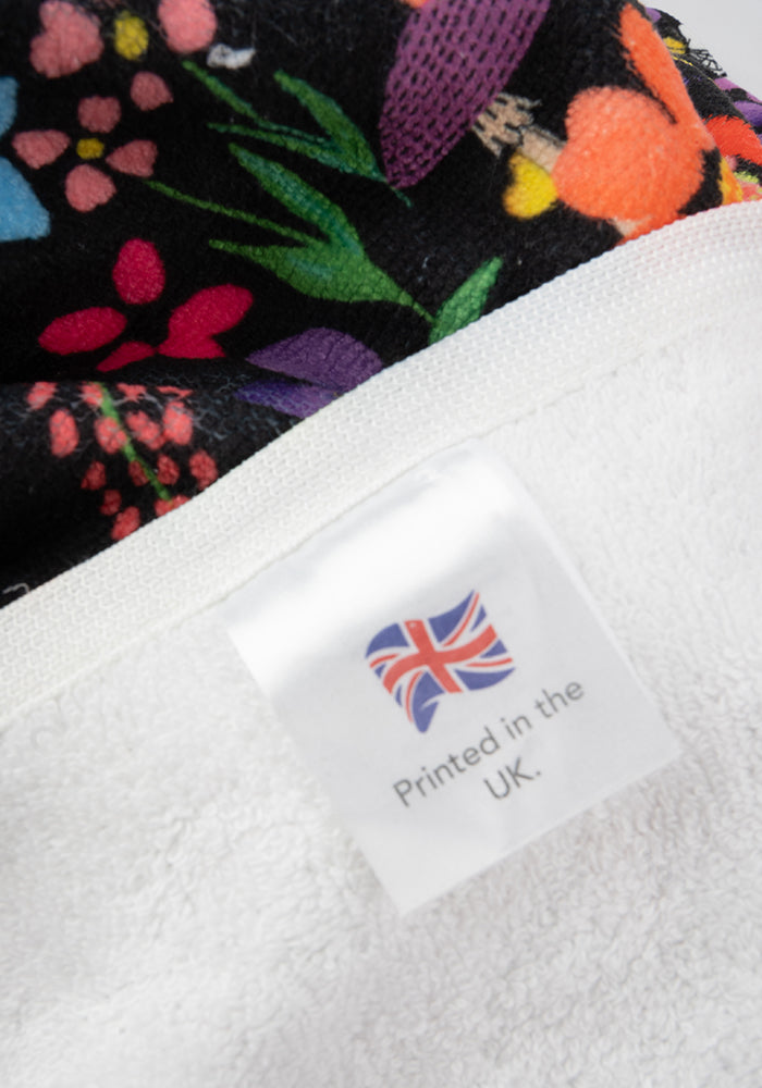 Fourth angle of Large Garden Rainbow Floral Print Towel