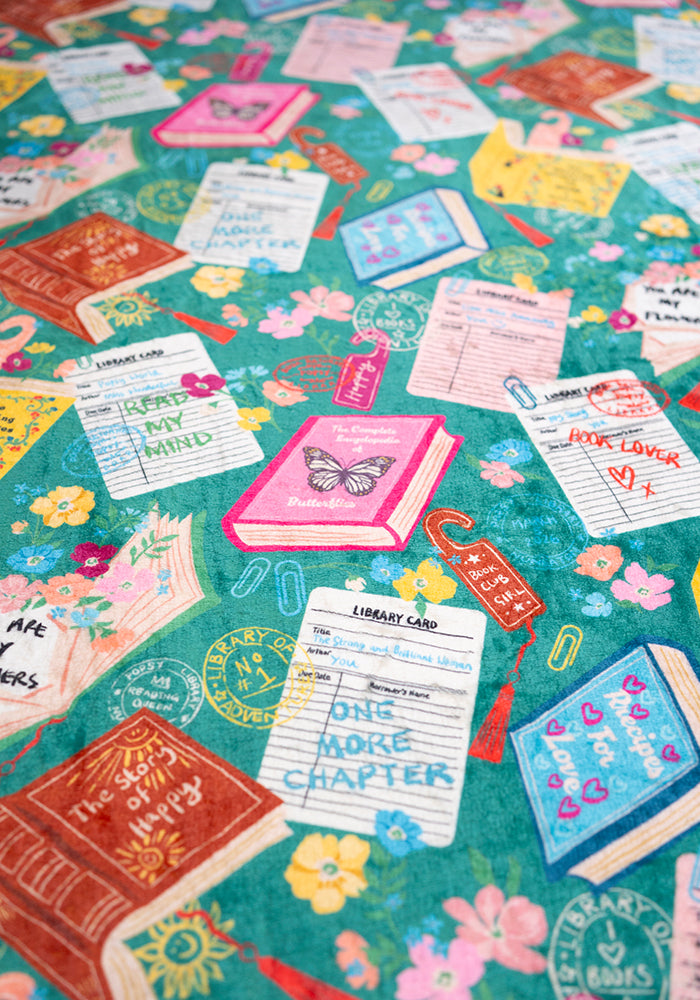 Fifth angle of Teal Library Books Print Plush Blanket (Pop-Under), teal Library Book print plush blanket from Popsy Clothing.