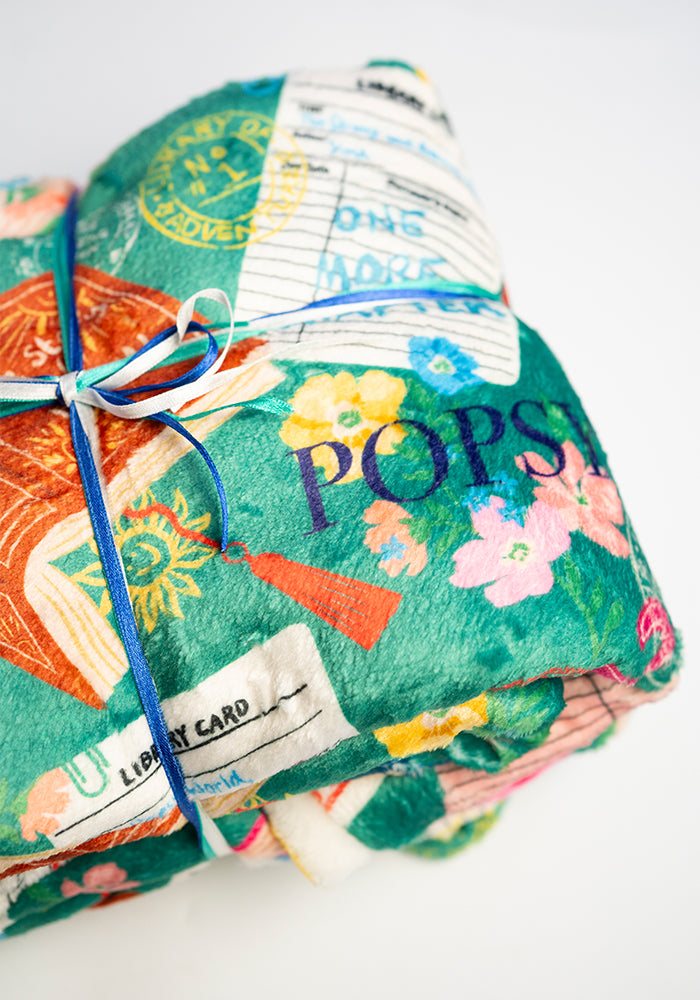 Sixth angle of Teal Library Books Print Plush Blanket (Pop-Under), teal Library Book print plush blanket from Popsy Clothing.