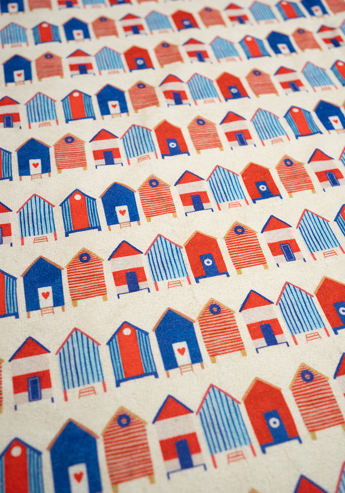 Fourth angle of Beach Hut Print Jumbo Bath Sheet, a jumbo bath sheet with a classic beach holiday vibe.