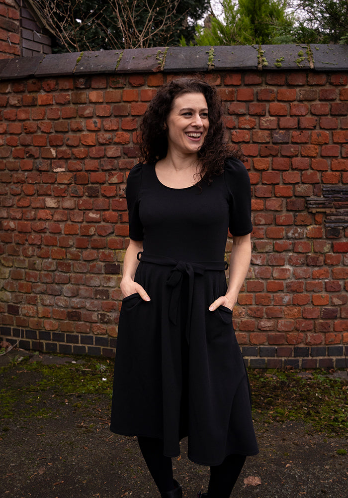 Third angle of Becca Black Textured Crepe Dress