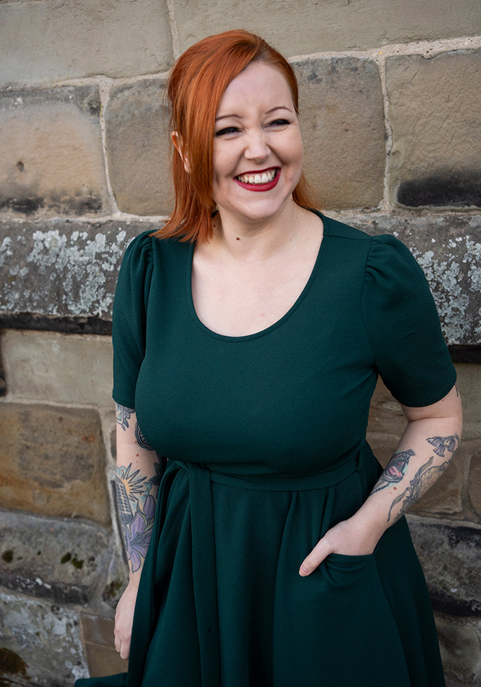 Fourth angle of Becca Bottle Green Textured Crepe Dress