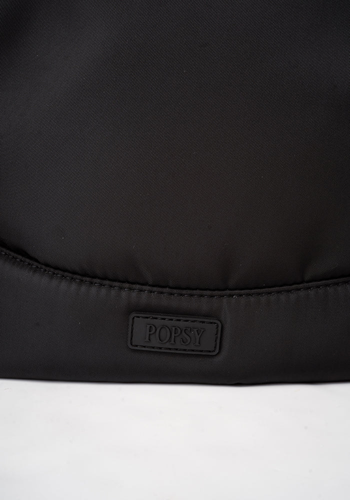 Second angle of Black Cabin Bag, a lightweight plain black cabin bag.
