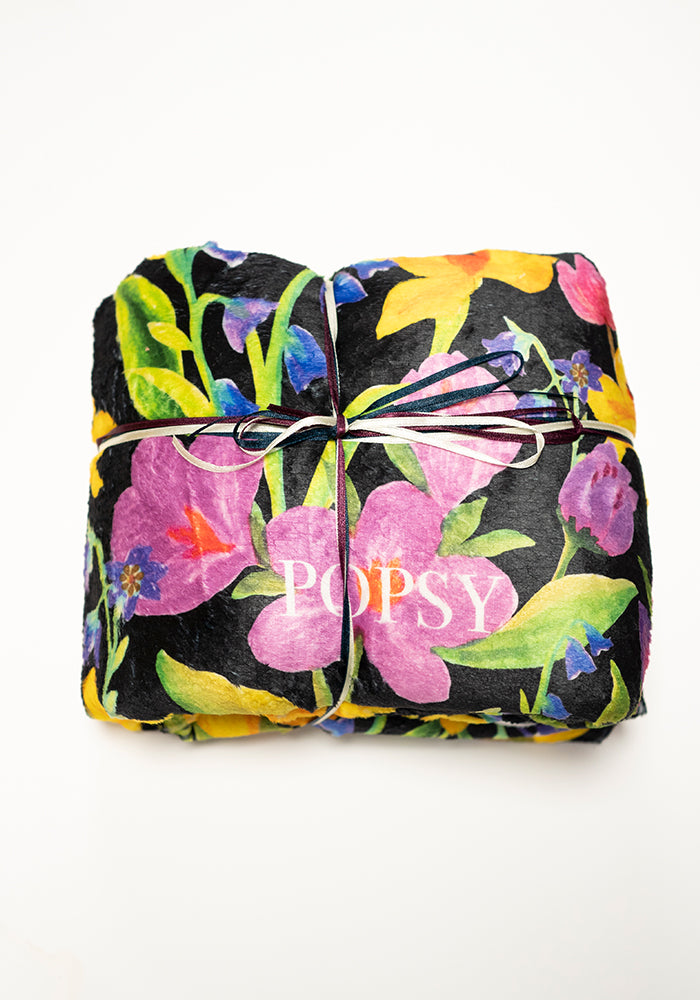 Front view of Bright Florals Print Pop-under Plush Blanket