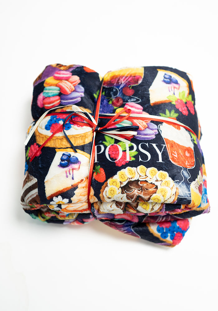Front view of Cake &amp; Desserts Print Pop-under Plush Blanket