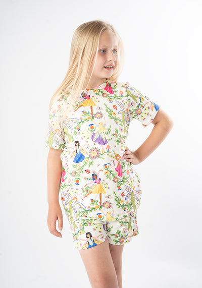 Young girl wearing a colourful pyjamas with fairy tale character print 