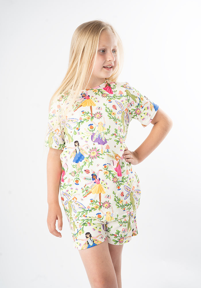 Young girl wearing a colourful pyjamas with fairy tale character print 