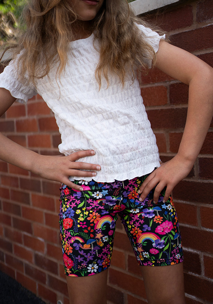 Front view of Children’s Garden Rainbow Print Cycling Shorts