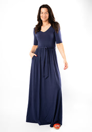 Woman wearing a navy blue maxi dress