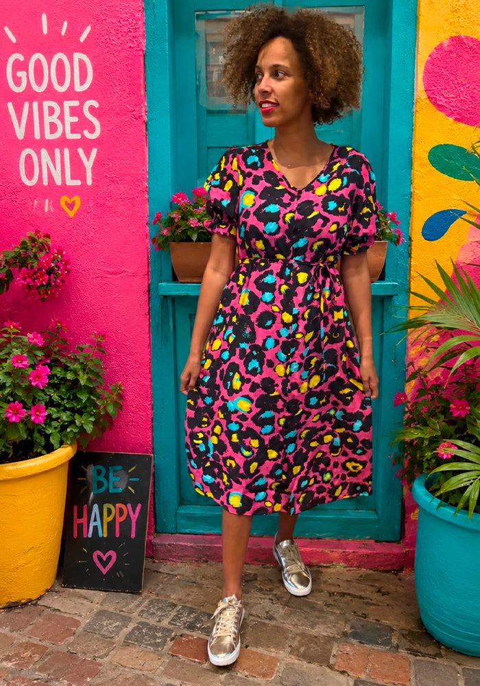 Front view of Cobi Pink Animal Print Midi Dress, a vibrant pink animal print midi dress perfect for holiday, travel and and every occasion.