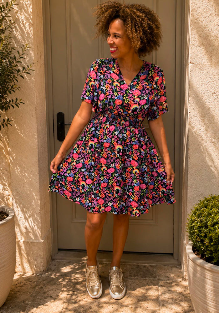 Front view of Corina Garden Rainbow Print Dress, a colourful garden rainbow print dress perfect for travel, holiday and every occasion.