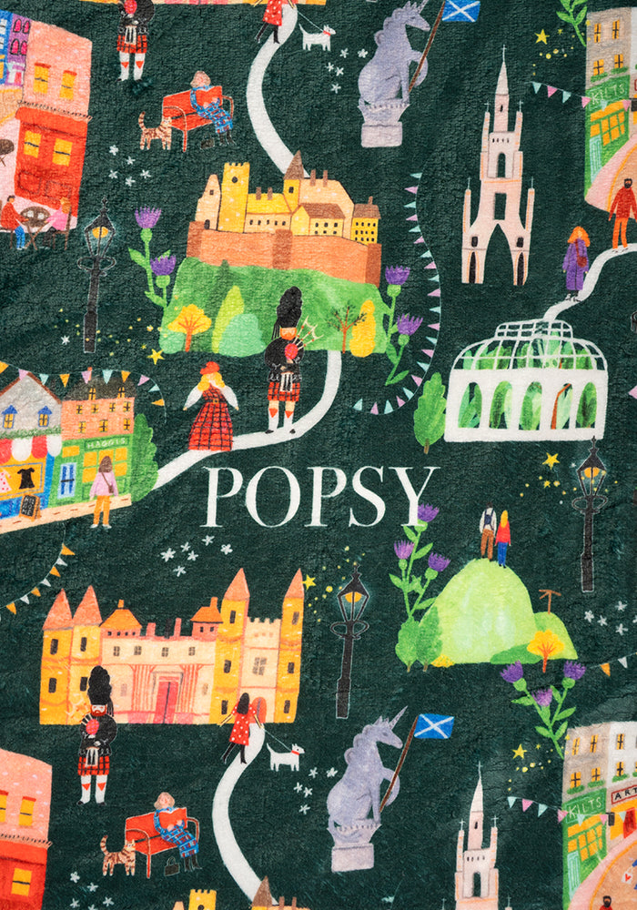 Third angle of Edinburgh Print Pop-under Plush Throw Blanket (Pop-Under), a cosy blanket with an Edinburgh inspired print.