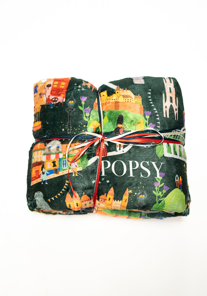 Front view of Edinburgh Print Pop-under Plush Throw Blanket (Pop-Under), a cosy blanket with an Edinburgh inspired print.