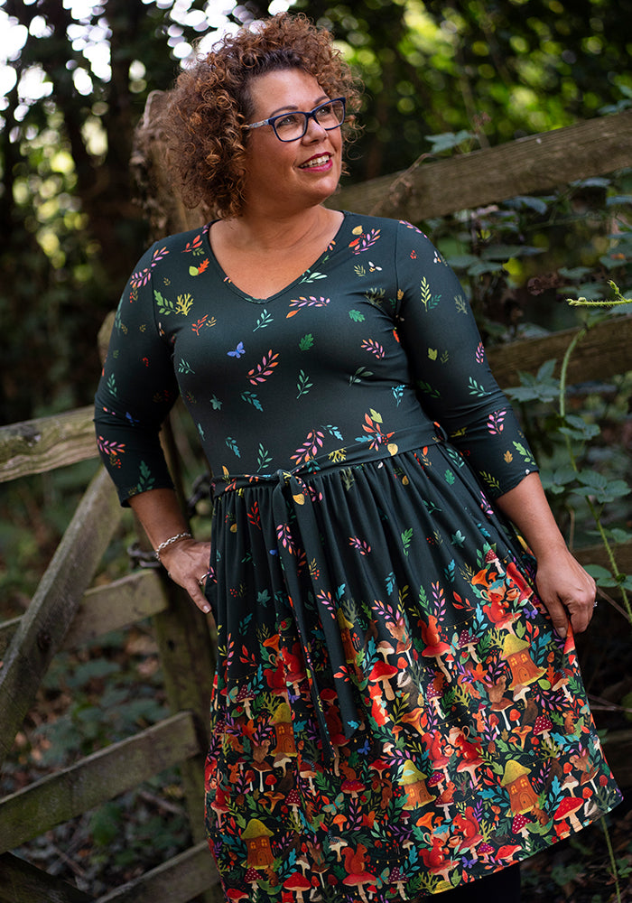 Front view of Elide Woodland Tea Party Border Print Dress