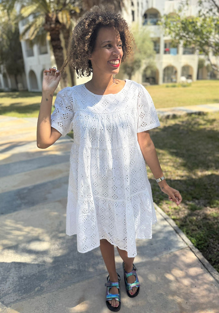 Front view of Emblyn White Broderie Anglaise Cotton Tiered Dress