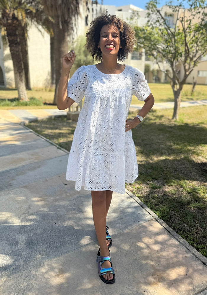 Third angle of Emblyn White Broderie Anglaise Cotton Tiered Dress