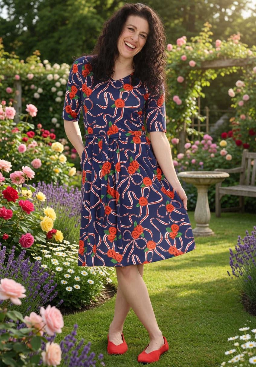 Front view of Navy England Print Flat Waist Jersey Dress, a classic navy dress with an England inspired print.