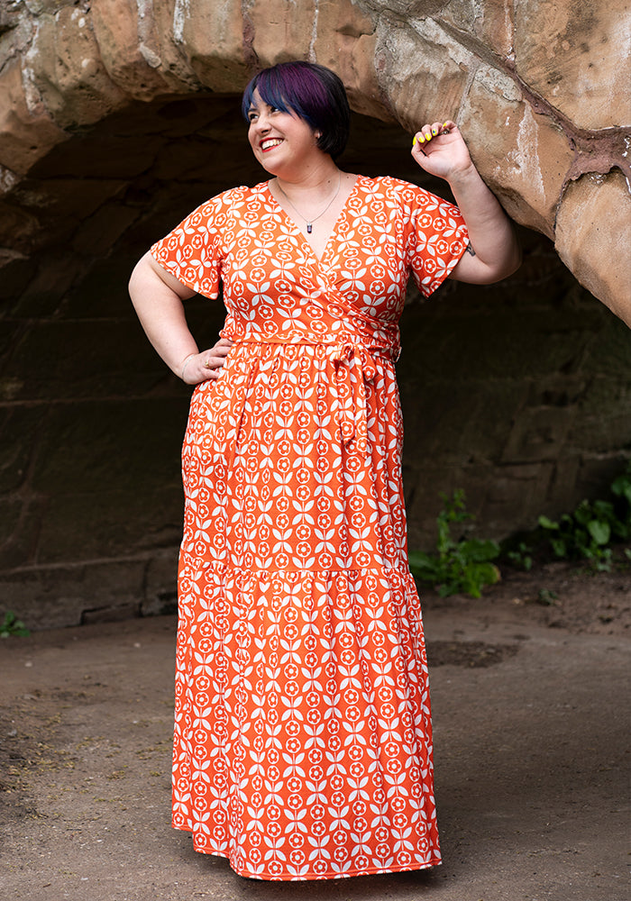 Front view of Esti Retro Flower Print Tiered Hem Maxi Dress