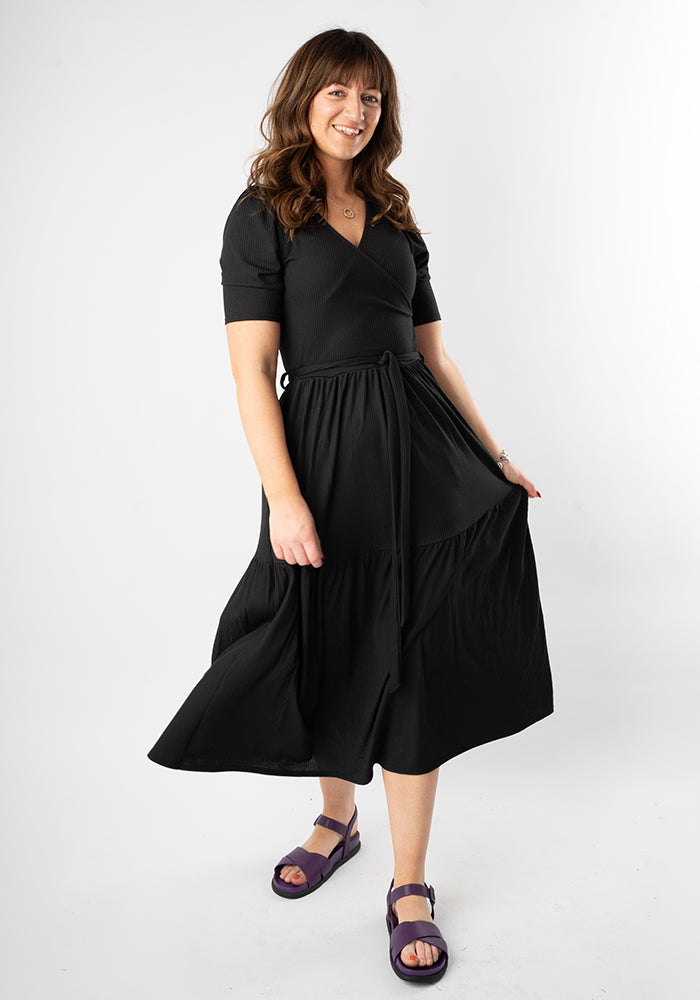 Third angle of Evie Black Rib Brush Tiered Hem Midi Dress