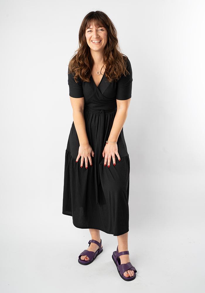 Front view of Evie Black Rib Brush Tiered Hem Midi Dress