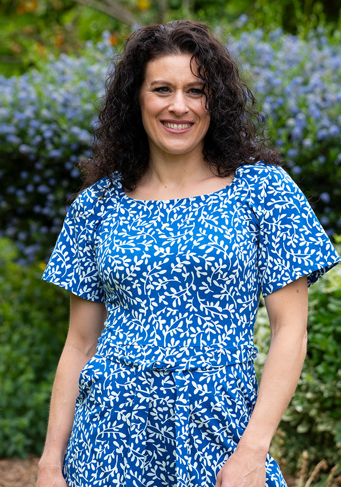 Second angle of Fia Blue Sprig Print Cotton Playsuit, blue and white cotton playsuit with all-over sprig pattern.