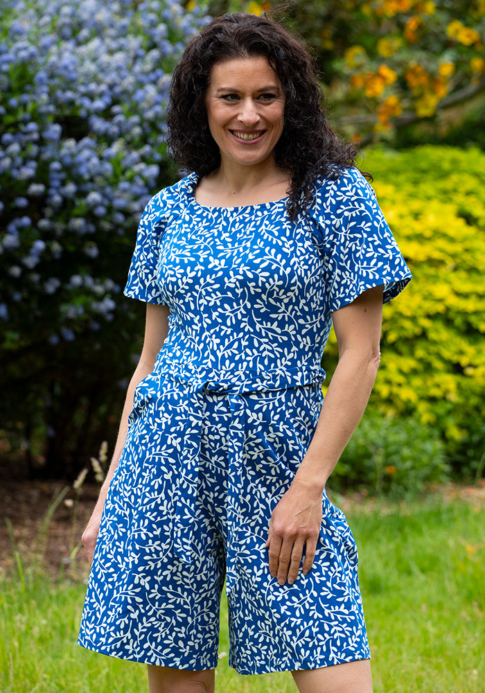 Third angle of Fia Blue Sprig Print Cotton Playsuit, blue and white cotton playsuit with all-over sprig pattern.