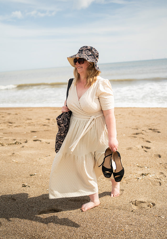 Third angle of Fossil Print Reversible Bucket Hat, fossil Print Reversible Bucket Hat Fun, practical and made for sunny days.