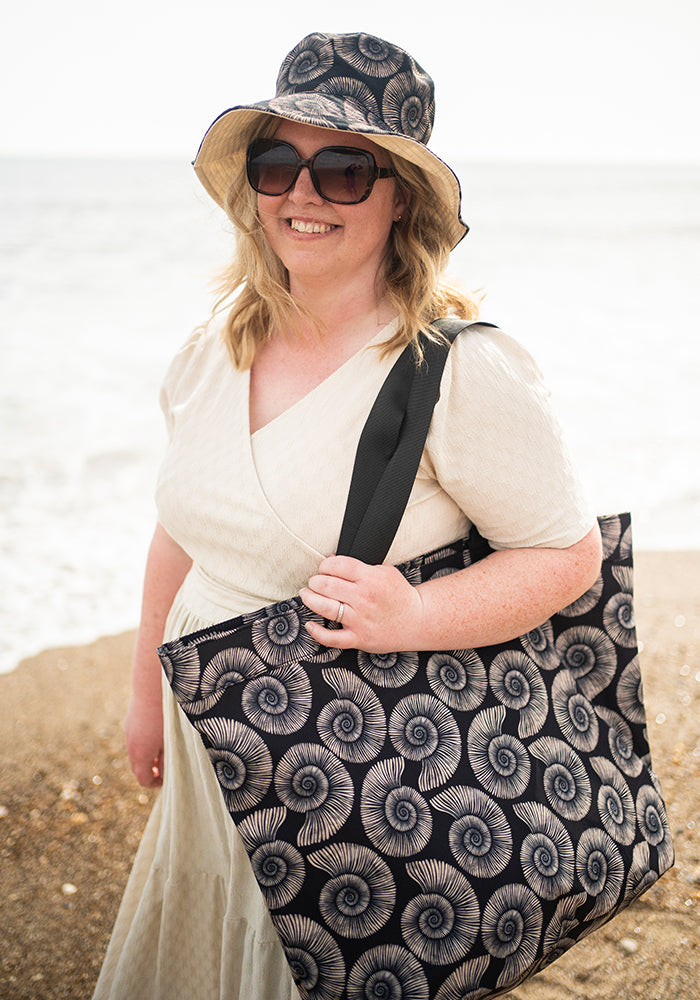 Fifth angle of Fossil Print Reversible Bucket Hat, fossil Print Reversible Bucket Hat Fun, practical and made for sunny days.