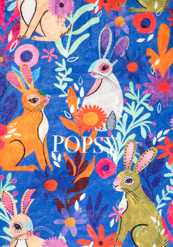 Third angle of Garden Bunnies Blue Print Pop-under Plush Blanket