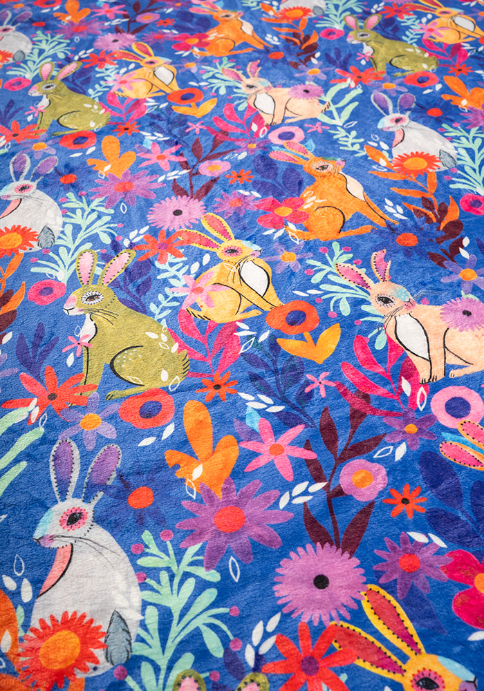 Fifth angle of Garden Bunnies Blue Print Pop-under Plush Blanket