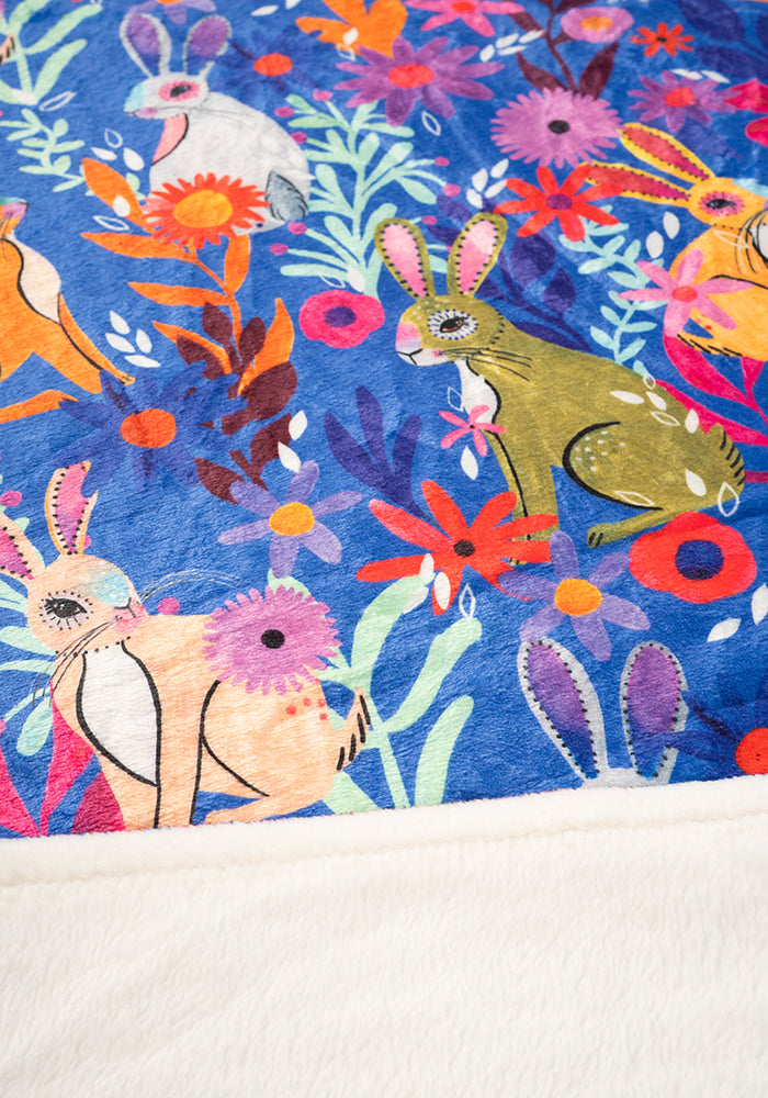 Sixth angle of Garden Bunnies Blue Print Pop-under Plush Blanket