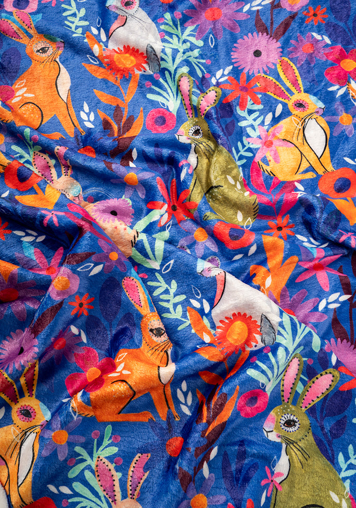 Second angle of Garden Bunnies Blue Print Pop-under Plush Blanket