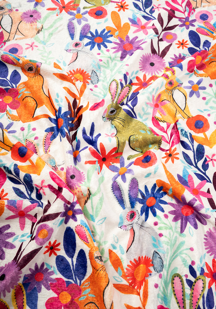 Second angle of Garden Bunnies Cream Print Pop-under Plush Blanket