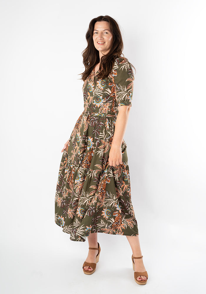Woman wearing a patterned floral tiger midaxi dress