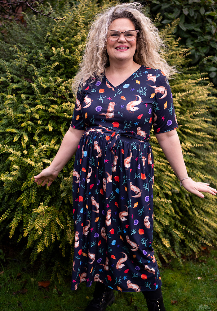 Sixth angle of Jaclyn Sea Otter Print Midi Dress, our jersey is a smooth, stretchy fabric known for its comfort and ease.